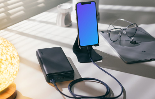 iPhone 12 mockup held on a phone-stand