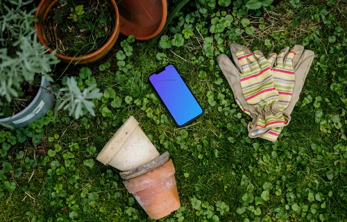 iPhone 13 mockup in garden