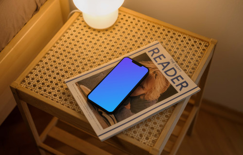 iPhone 13 mockup on magazine