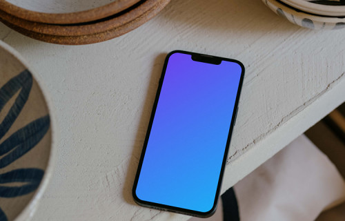 iPhone 13 mockup on table