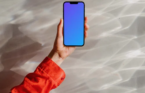iPhone 13 Pro mockup held up against an ethereal background