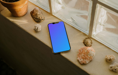 iPhone 13 Pro mockup on a window ledge