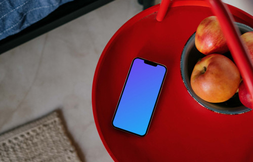 iPhone 13 Pro mockup placed next to a fruit bowl