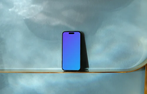 iPhone 14 Pro and blue patterned background