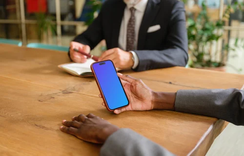 iPhone 14 Pro mockup in businesswoman’s hand