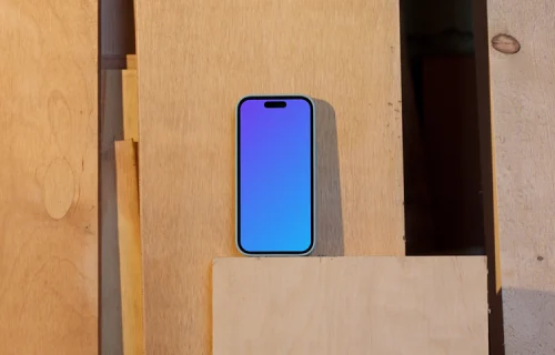 iPhone 14 Pro mockup placed on a wooden board
