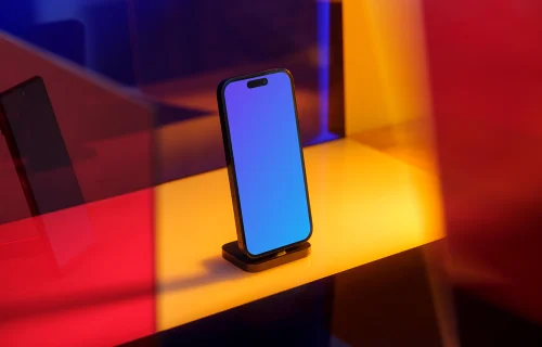 iPhone 14 Pro mockup standing on a yellow pad