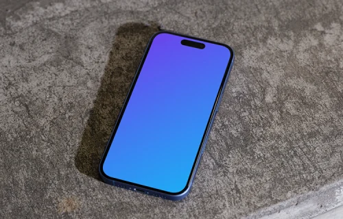 iPhone 16 mockup on a concrete surface
