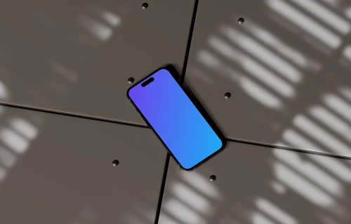 iPhone 16 mockup on a geometric surface