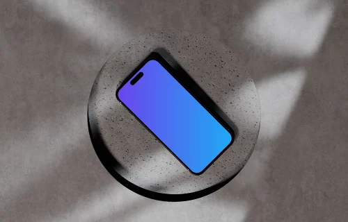 iPhone 16 mockup on a textured concrete surface