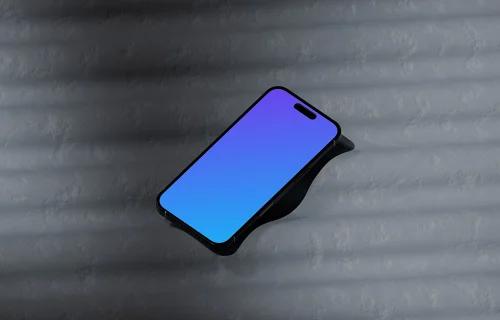 iPhone 16 mockup on a textured surface