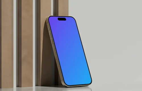 iPhone 16 mockup standing on reflective surface with geometric backdrop