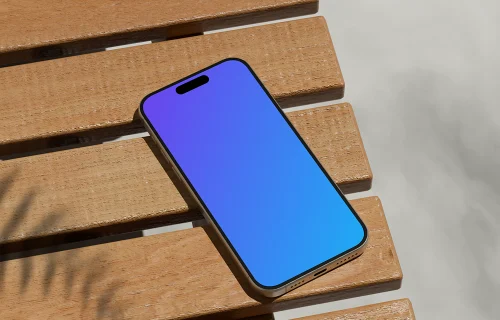 iPhone 16 mockup with shadows on wooden slats