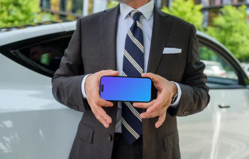 iPhone mockup in businessman’s hands