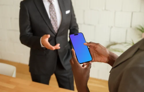 iPhone mockup in office setting with businesspeople