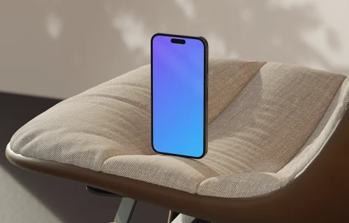 iPhone mockup on a modern fabric chair