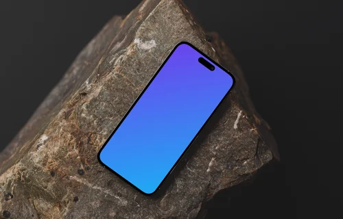 iPhone mockup on textured stone surface