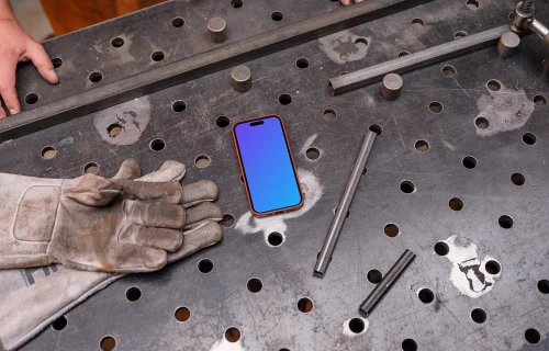 iPhone mockup placed on an iron table