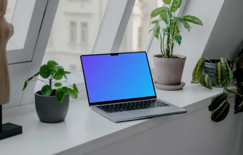 Laptop mockup next to the window