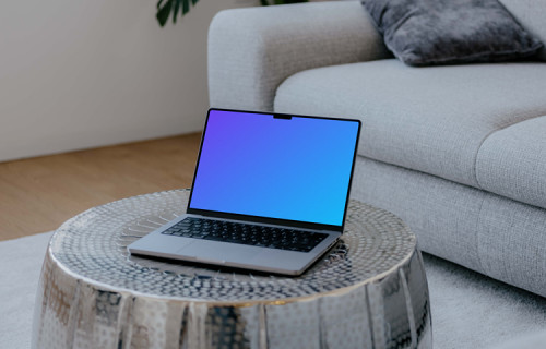 Laptop mockup on the silver table
