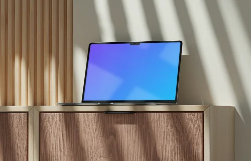 MacBook Air mockup on a wooden cabinet with natural light