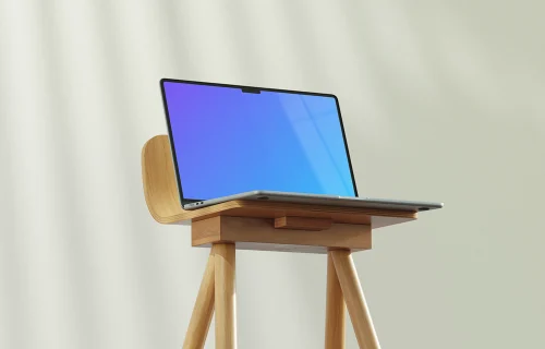 MacBook Air mockup on a wooden stand in soft lighting