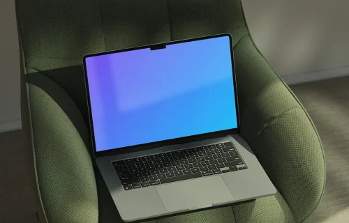 MacBook Air mockup on green chair in natural light