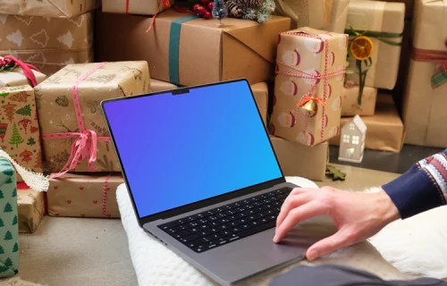 MacBook mockup next to the Christmas tree and gifts