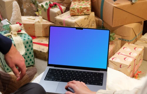 MacBook Pro 14 mockup surrounded by Christmas gifts