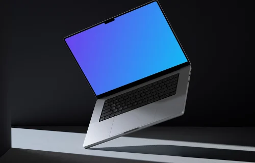 MacBook Pro 16 inch mockup floating over dual-tone backdrop