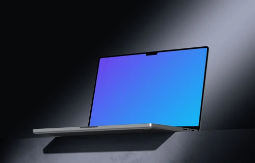 MacBook Pro 16 inch mockup on a textured tabletop with dramatic lighting