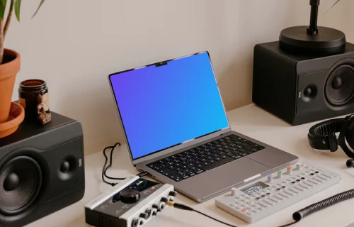 MacBook Pro mockup in the small podcast studio