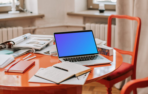 MacBook Pro mockup on a red table