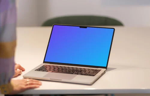 MacBook Pro Mockup on Office Desk with Person in Background