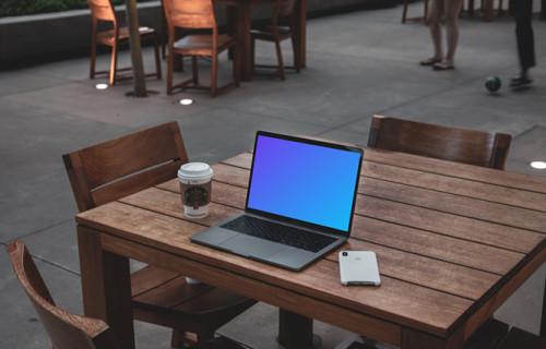 MacBook Pro mockup on wooden desk