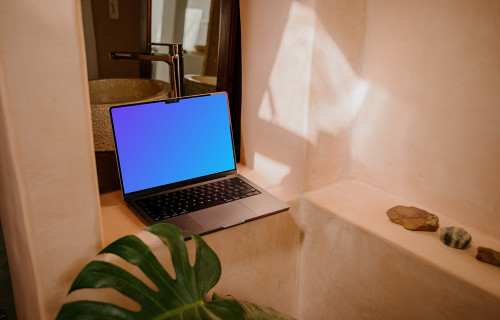 MacBook Pro mockup under a faucet