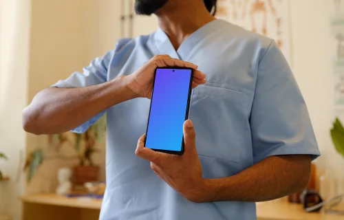 Male doctor holding a Google Pixel mockup
