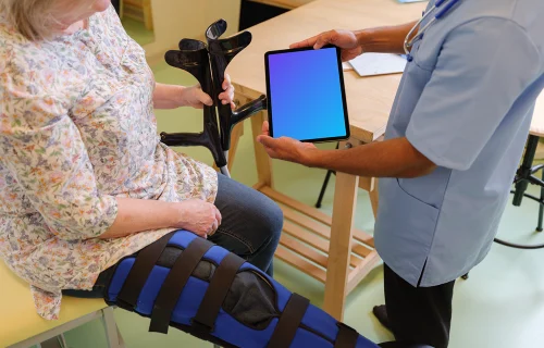 Male doctor holding an iPad mockup