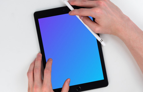Male hands drawing on iPad Mini mockup