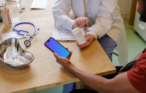 Male patient holding the iPhone mockup