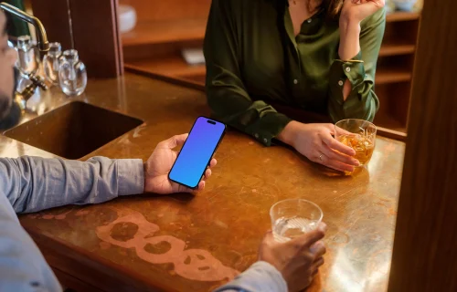 Man holding a iPhone mockup in the lounge
