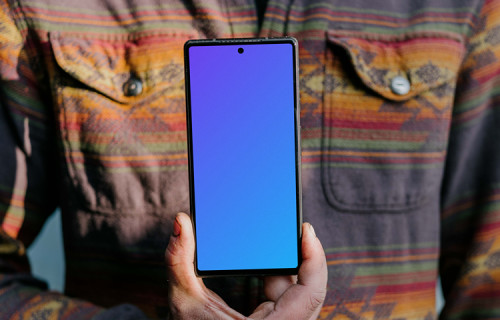 Man holding up a Pixel 6 mockup
