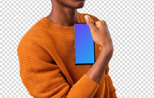 Man in orange sweater holding Google Pixel mockup in one hand