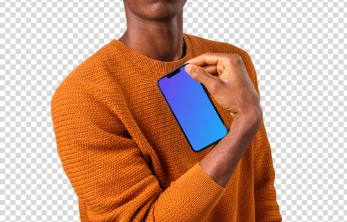 Man in orange sweater holding iPhone mockup in one hand