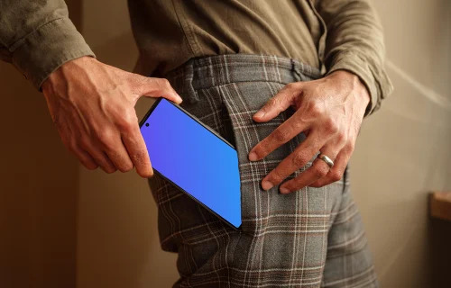 Man taking a phone mockup out of his pocket
