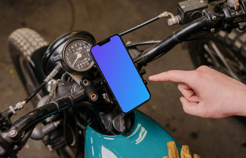 Motorcycle rider using an iPhone 13 Pro mockup