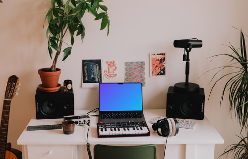 Music Mockup with MacBook Pro on the table
