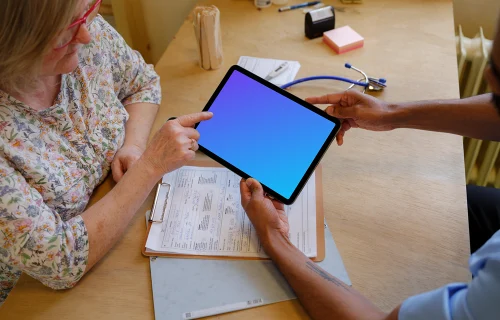 Patient and the doctor with a tablet mockup