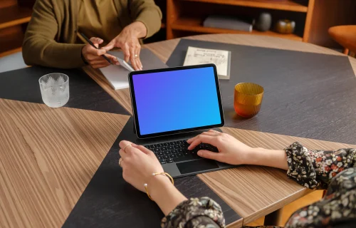 People working in the office with iPad mockup