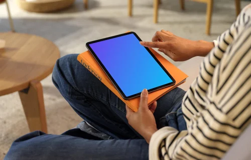 Person scrollin on an iPad Air mockup